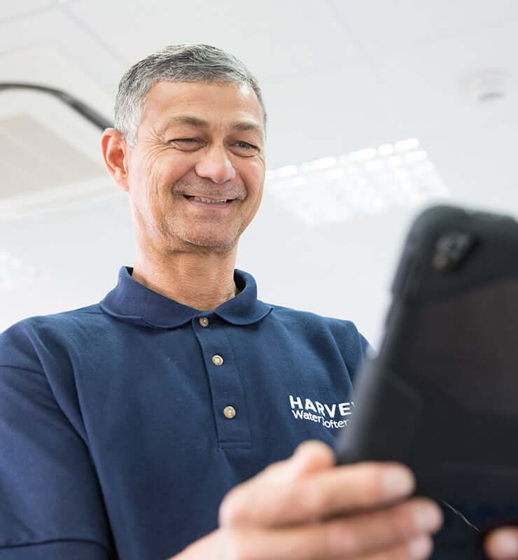 Harvey Demonstrator reading tablet screen
