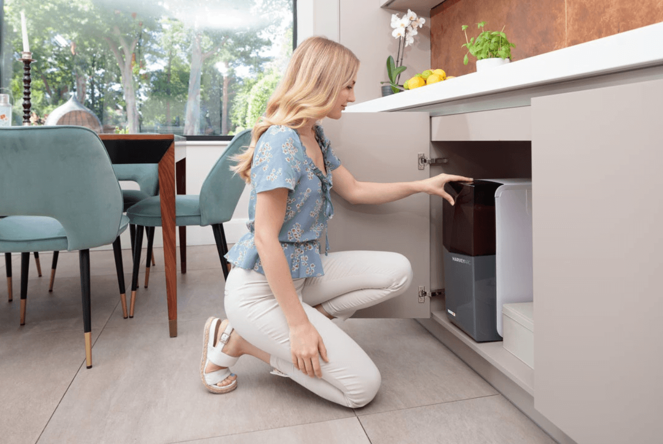a lady refilling her harveyarc water softener